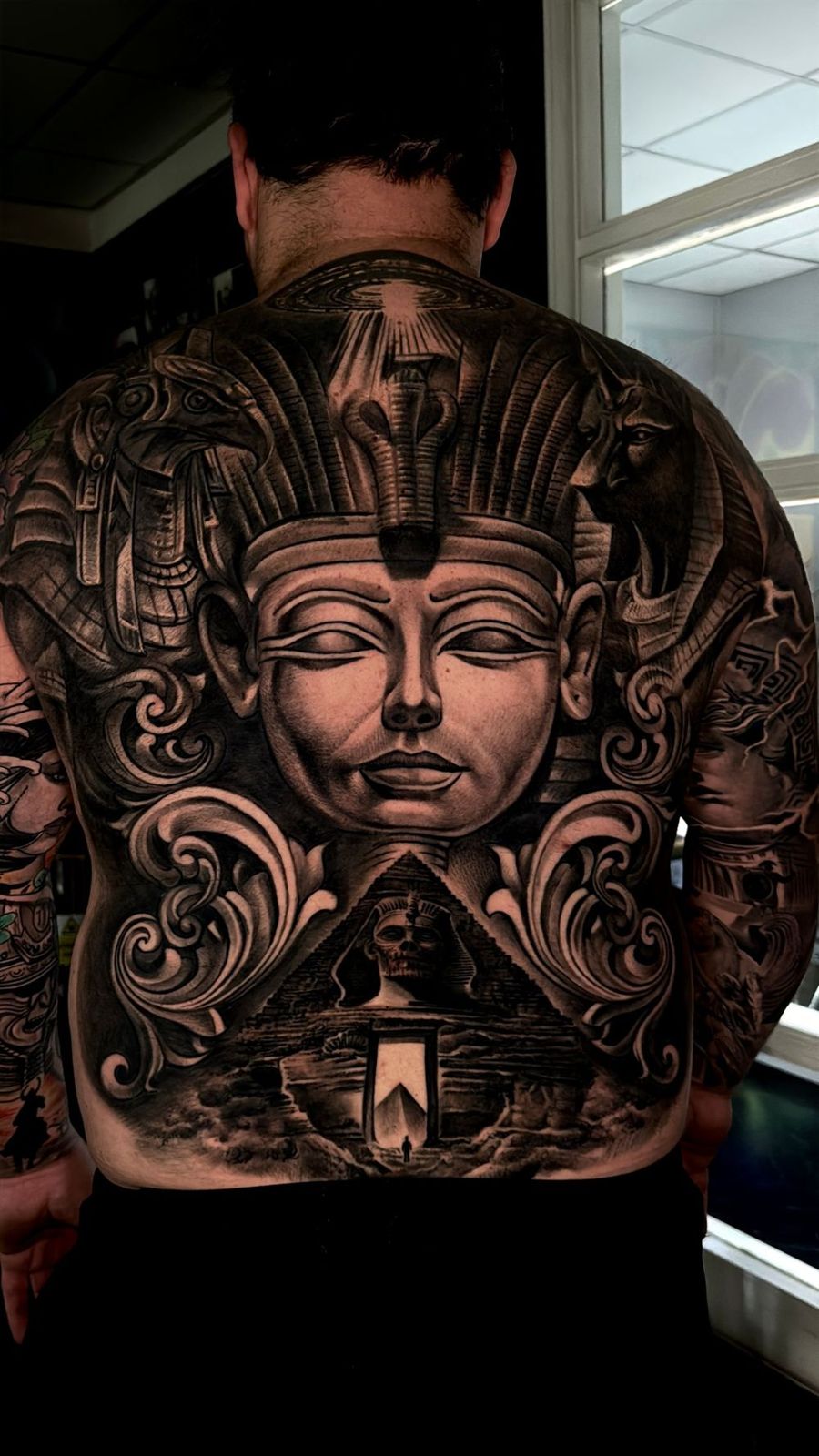 Ornate black and grey back piece by Andre Fila, Treze Ink Coventry