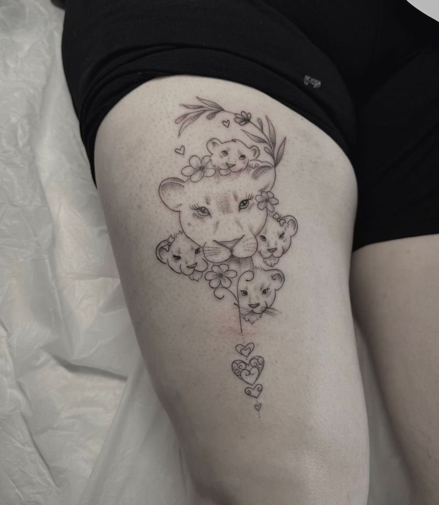 Fine-line floral thigh tattoo by Camila Fila, Treze Ink Coventry